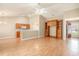 Living room features wood floors, vaulted ceilings, half-wall to kitchen, and built-in shelves at 946 Wyndfall Dr., Sunset Beach, NC 28468