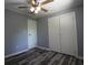 This bedroom features a ceiling fan, two closets and luxury vinyl plank flooring at 950 Forestbrook Rd. # B-8, Myrtle Beach, SC 29588