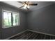 Bedroom with window, gray walls, luxury vinyl plank flooring, and natural light at 950 Forestbrook Rd. # B-8, Myrtle Beach, SC 29588