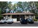 Condo exterior showing multiple parked cars and an open entry way at 950 Forestbrook Rd. # B-8, Myrtle Beach, SC 29588