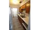 This kitchen features oak cabinets, light countertops, stainless steel appliances and a stainless steel sink at 950 Forestbrook Rd. # B-8, Myrtle Beach, SC 29588