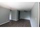 This living room features bright white paint and luxury vinyl plank flooring at 950 Forestbrook Rd. # B-8, Myrtle Beach, SC 29588