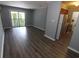 Spacious living room with luxury vinyl plank flooring and natural light at 950 Forestbrook Rd. # B-8, Myrtle Beach, SC 29588
