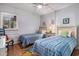 Bedroom featuring two twin beds with blue checkered bedspreads, and a central nightstand at 9501 Shore Dr. # 135, Myrtle Beach, SC 29572
