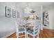 This dining area features a round glass table and is adjacent to the kitchen at 9501 Shore Dr. # 135, Myrtle Beach, SC 29572