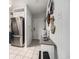 Entryway into condo featuring stainless steel refrigerator and nautical-themed decor at 9501 Shore Dr. # 135, Myrtle Beach, SC 29572