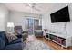 Cozy living room has a wall mounted TV, two recliners and opens to a balcony at 9501 Shore Dr. # 135, Myrtle Beach, SC 29572