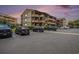 Exterior shot of the building and parking lot, showcasing ample parking and community at 9501 Shore Dr. # 135, Myrtle Beach, SC 29572