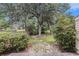 A cozy backyard space, enhanced by landscaping, offers a private outdoor retreat at 951 Plantation Dr. # F1, Little River, SC 29566