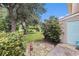 A serene backyard featuring lush greenery, mature trees, and a well-maintained lawn at 951 Plantation Dr. # F1, Little River, SC 29566