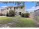 A fenced backyard with lush lawn provides a private retreat for outdoor living at 951 Plantation Dr. # F1, Little River, SC 29566