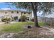Private fenced backyard, ideal for entertaining and relaxing, featuring mature tree and patio set at 951 Plantation Dr. # F1, Little River, SC 29566