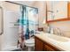 Bathroom featuring a walk-in shower, vanity, new fixtures, and a beach-themed curtain at 951 Plantation Dr. # F1, Little River, SC 29566