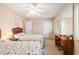 This bedroom offers twin beds, a ceiling fan, and a vanity desk at 951 Plantation Dr. # F1, Little River, SC 29566