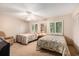 Comfortable bedroom with two twin beds, ceiling fan, and natural light at 951 Plantation Dr. # F1, Little River, SC 29566