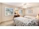 Cozy bedroom features twin beds, desk, ceiling fan, and neutral decor at 951 Plantation Dr. # F1, Little River, SC 29566
