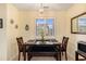 Inviting dining area features a dark wood table with seating for four and a view to the outside at 951 Plantation Dr. # F1, Little River, SC 29566