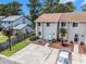 Well-maintained townhome featuring landscaped grounds, dedicated parking, and a welcoming entrance at 951 Plantation Dr. # F1, Little River, SC 29566