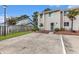 Inviting townhouse featuring a neatly landscaped front yard, a patio set, and convenient parking space at 951 Plantation Dr. # F1, Little River, SC 29566