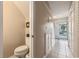 Hallway view leading to the front door, with a half bath on the left at 951 Plantation Dr. # F1, Little River, SC 29566