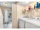 Convenient laundry room equipped with washer and dryer, offering ample storage space at 951 Plantation Dr. # F1, Little River, SC 29566