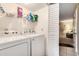 Laundry room with white appliances, shelving and close proximity to other living spaces at 951 Plantation Dr. # F1, Little River, SC 29566