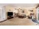 Open living room with view to kitchen bar, ceiling fan, comfortable seating, and neutral decor at 951 Plantation Dr. # F1, Little River, SC 29566