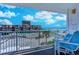 Balcony view with blue lounge chairs overlooking the ocean and pool at 9550 Shore Dr. # 225, Myrtle Beach, SC 29572