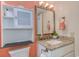 Bathroom featuring vanity with granite countertop, framed mirror, vanity lighting and toilet at 9550 Shore Dr. # 225, Myrtle Beach, SC 29572