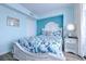 Cozy bedroom featuring blue accents, beach-themed bedding, and white wood furnishings creating a tranquil atmosphere at 9550 Shore Dr. # 225, Myrtle Beach, SC 29572