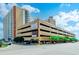 Sands Ocean Club building featuring a parking garage and signage at 9550 Shore Dr. # 225, Myrtle Beach, SC 29572