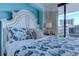 Inviting main bedroom decorated in blue hues with balcony views at 9550 Shore Dr. # 225, Myrtle Beach, SC 29572