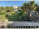 Charming home with a well-manicured lawn, lush trees and a peek at the home from the community deck at 5732 N Ocean Blvd., Myrtle Beach, SC 29577