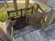 Exterior stairs leading down from the wooden walkway of a beachfront cottage at 5732 N Ocean Blvd., Myrtle Beach, SC 29577