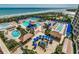 Aerial shot of luxurious pool area with cabanas, lounge chairs, and ocean views at 100 North Beach Blvd. # 1816, North Myrtle Beach, SC 29582