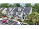 Aerial view of townhomes with well-maintained landscaping and parking at 108 Barnacle Ln. # 4, Little River, SC 29566