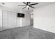 Bedroom features a mounted TV, neutral carpet, closet space, and a ceiling fan at 108 Barnacle Ln. # 4, Little River, SC 29566