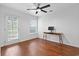 This bedroom includes a door to the outside, desk and ceiling fan at 108 Barnacle Ln. # 4, Little River, SC 29566
