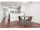 Cozy dining area with hardwood floors and seating for two, next to the kitchen at 108 Barnacle Ln. # 4, Little River, SC 29566