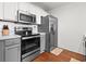 Modern kitchen featuring stainless steel appliances, white countertops, and gray cabinets at 108 Barnacle Ln. # 4, Little River, SC 29566
