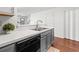 An updated kitchen features stainless steel appliances and a white quartz countertop at 108 Barnacle Ln. # 4, Little River, SC 29566