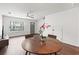 The living room features a ceiling fan, a front door view, and a dining area at 108 Barnacle Ln. # 4, Little River, SC 29566