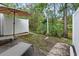 A serene patio setting with an umbrella, chairs and a lush wooded view, perfect for relaxing at 108 Barnacle Ln. # 4, Little River, SC 29566