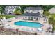 Inviting community pool surrounded by ample seating and lush landscaping at 108 Barnacle Ln. # 4, Little River, SC 29566
