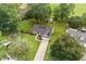 Aerial view of charming home with solar panels, lush landscaping and driveway at 1100 Rosetta Dr., Conway, SC 29526