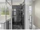 Bathroom featuring a black marbled shower, glass door and wall, as well as a soaking tub and toilet at 1100 Rosetta Dr., Conway, SC 29526