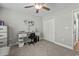 Bedroom with gray walls, a ceiling fan, gray carpet, and a white desk with a black chair at 1100 Rosetta Dr., Conway, SC 29526
