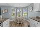 Breakfast nook featuring a round wood table and views of the backyard at 1100 Rosetta Dr., Conway, SC 29526