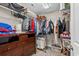 Walk-in closet with wire shelving, rods for hanging clothes, and a dresser for additional storage at 1100 Rosetta Dr., Conway, SC 29526
