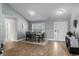 Neutral dining room features wood floors, a table for six, and a front door view at 1100 Rosetta Dr., Conway, SC 29526